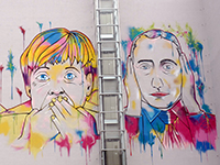 Merkel & Putin Graffiti (Foto: lord jim, Flickr, CC BY 2.0).
