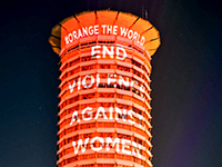 Tower building lit with orange light and white letters #orange the world End Violence Against Women. Photo: UN Women via flickr, CC BY-NC-ND 2.0